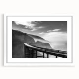 Abstract art print of Big Sur with cool blue and green tones on a framed white mat, ideal for bedroom or dining room decor.