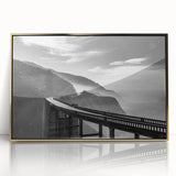 Large art print of Big Sur, California, in mid-century modernist style, with muted earth tones on a framed acrylic.