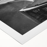 Art Deco-style poster of Big Sur coastline on a rolled canvas, with cool blue and green hues, ideal for dining room wall art.