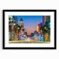 Colorful abstract art print of Hollywood scenery in vibrant hues on a large framed canvas, suitable for living room decor.
