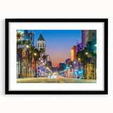 Colorful abstract art print of Hollywood scenery in vibrant hues on a large framed canvas, suitable for living room decor.