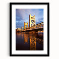 Abstract art print depicting a colorful, textured scenery of Sacramento, presented in a large black-framed mat.