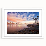 Abstract art print of San Diego skyline in muted blue tones on a framed white mat, ideal for dining room decor.