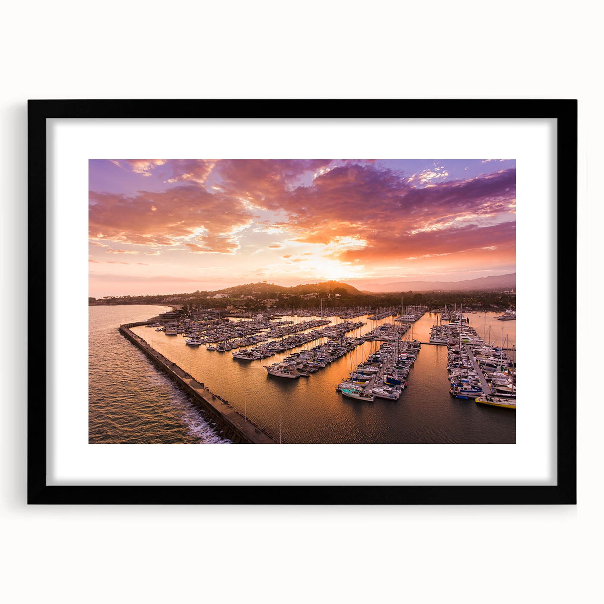 Colorful abstract art print of Santa Barbara scenery in a black frame, ideal for living room decor.