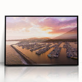 Large abstract wall art depicting the Santa Barbara coast in muted blue and green tones on a black framed acrylic print.