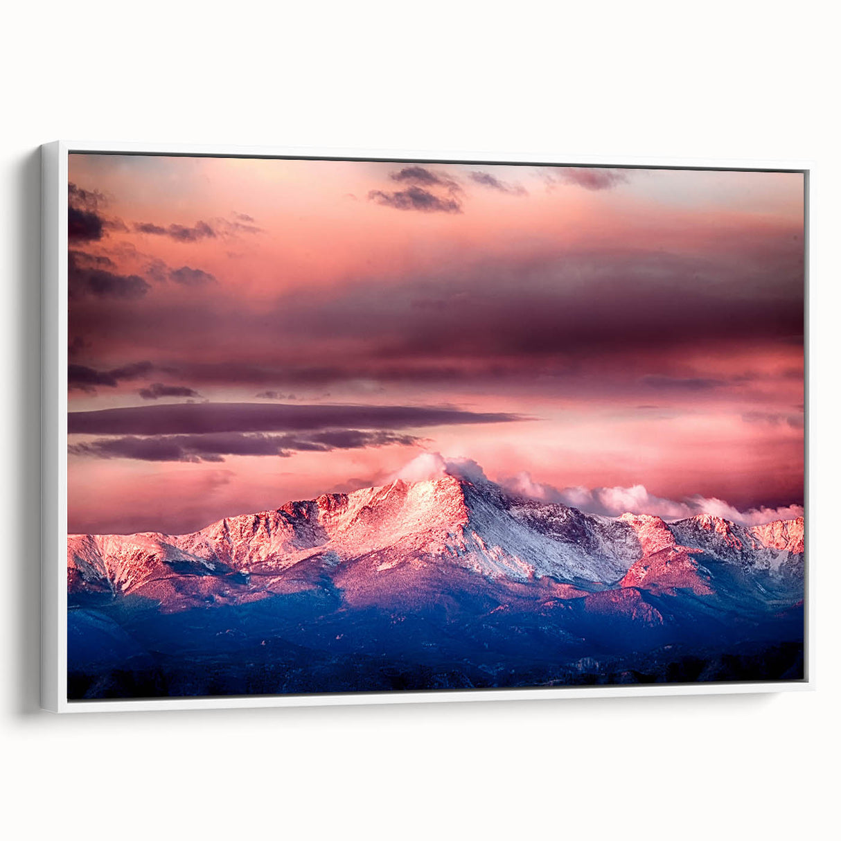 Vintage poster art of Pikes Peak in colorful hues on a large framed canvas, ideal for living room decor.