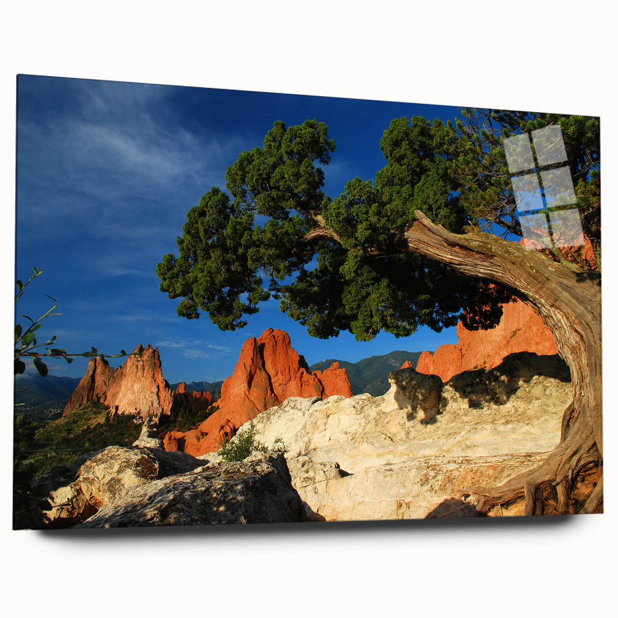 Acrylic print of a large abstract portrayal of Colorado Springs in vibrant blue and green tones.