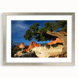 Textured art depicting abstract Colorado Springs scenery in muted earth tones on a framed silver mat.
