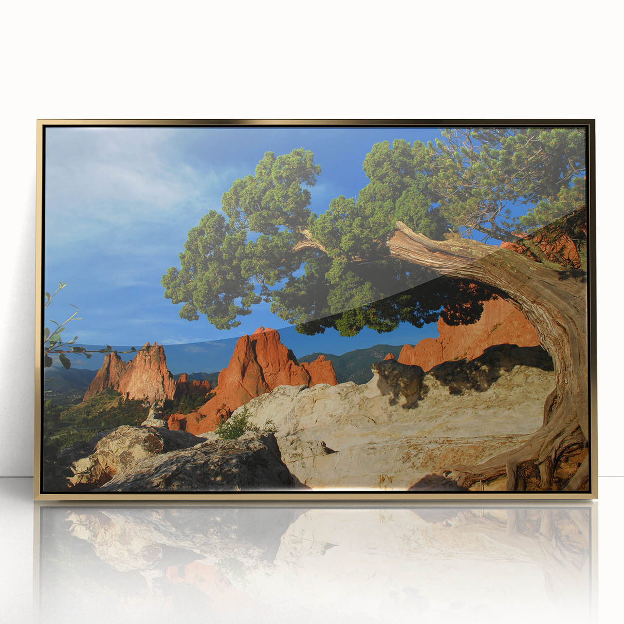 Large art print of Colorado Springs scenery in mid-century modernist style on gold-framed acrylic.