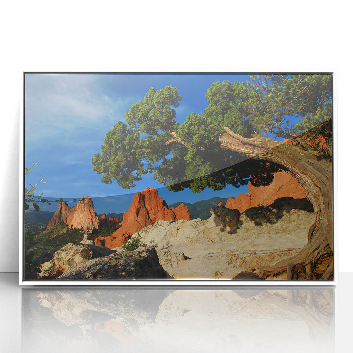 Acrylic print of Colorado Springs scenery in muted earth tones, framed in white, suitable for modern nursery wall decor.