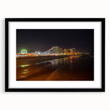 Abstract art print depicting colorful, textured scenery, framed in black, ideal for living room decor.