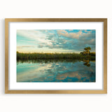 Extra large abstract art print depicting the Everglades in textured shades of green and blue, framed in gold.
