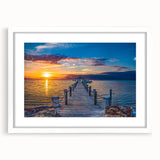 Abstract art print of Florida Keys scenery in muted blue and green tones on a white framed mat, ideal for dining room decor.