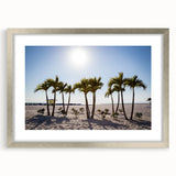 Textured abstract art print of a serene Palm Beach scene in muted blue and white tones, framed in silver.
