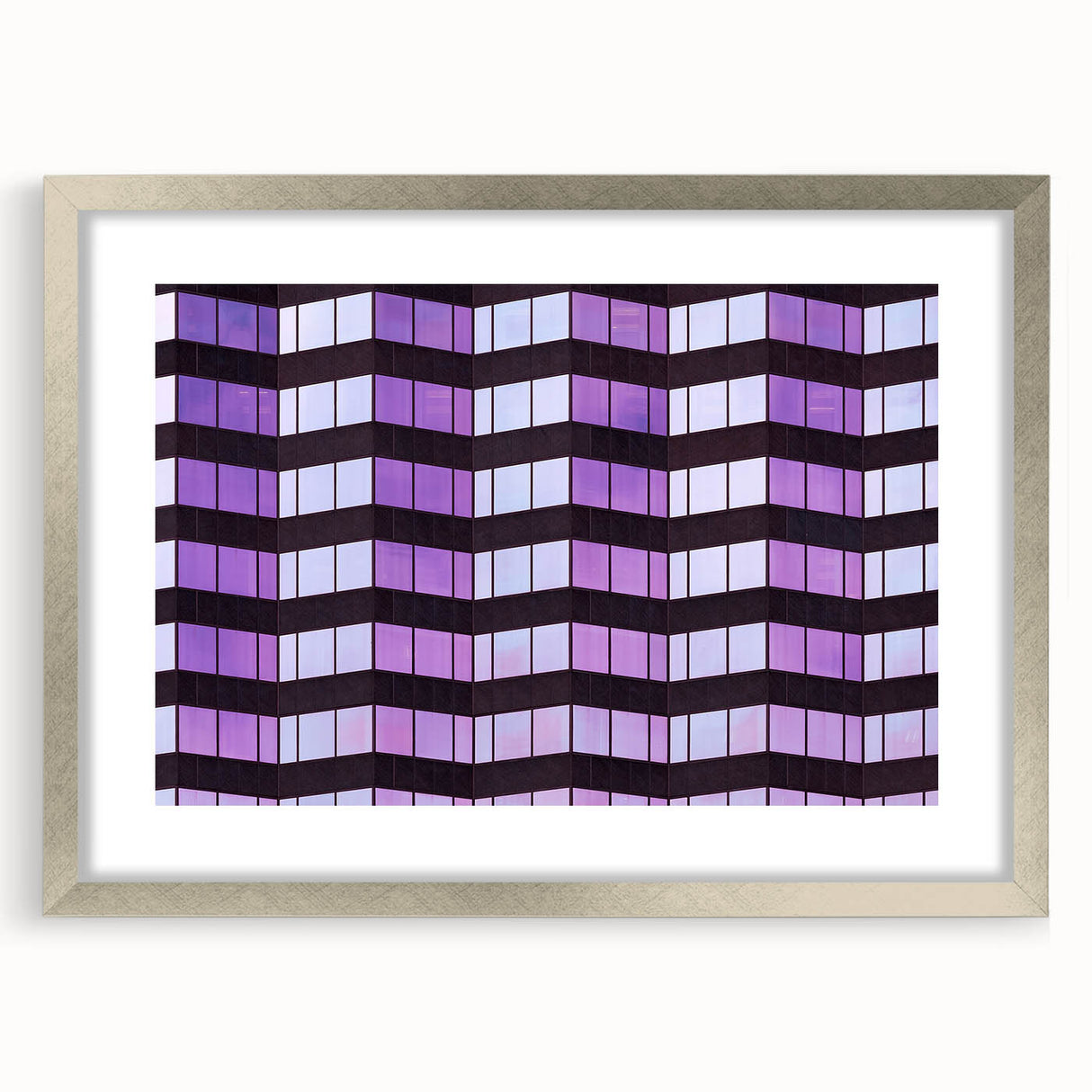 Textured abstract art print of Tampa skyline in muted blue and gray, framed in silver, ideal for bedroom decor.