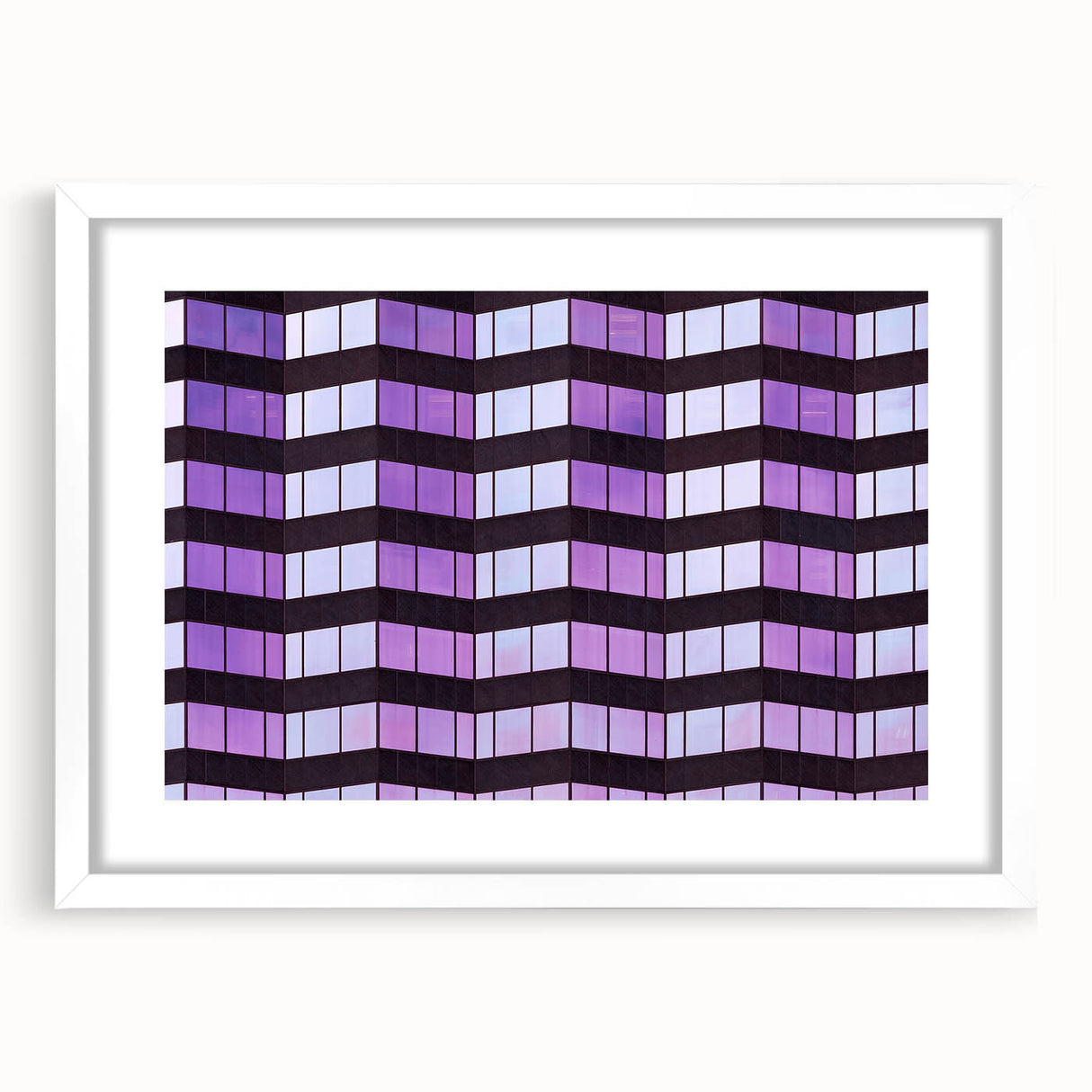 Abstract art print of Tampa skyline in muted gray and blue tones on a framed white mat.