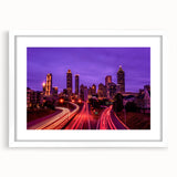 Abstract art print of Atlanta skyline in muted gray tones on a framed white mat, suitable for dining room decor.