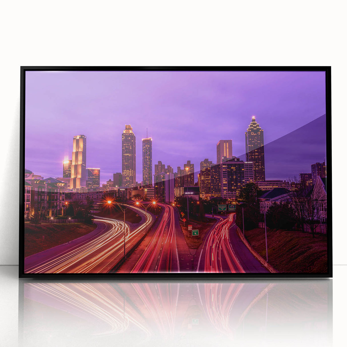 Large abstract wall art depicting the Atlanta skyline in muted gray and blue tones on a framed acrylic print.