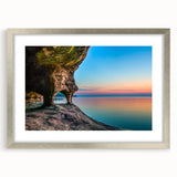Textured art of abstract Lake Michigan, in muted blue and gray, framed with a silver mat, suitable for bedroom decor.