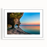 Abstract art print of Lake Michigan in muted blue tones, framed with a white mat, suitable for dining room decor.