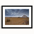 Abstract art print of Iowa scenery in vibrant colors on a textured, large canvas, framed in black.