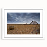 Abstract art print of Iowa scenery in muted green and blue tones, framed with a white mat, suitable for dining room decor.
