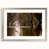 Textured art print of abstract Louisiana scenery in muted earth tones, silver-framed with mat, suitable for bedroom decor.
