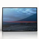 Large abstract wall art depicting Acadia's coastline, in muted blues and greens, framed in black acrylic.