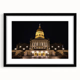 Colorful abstract art print of Kansas City skyline in vibrant hues on a framed black mat, ideal for living room decor.