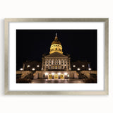 Textured art print of Kansas City skyline in muted gray tones on a framed silver mat, suitable for modern bedroom decor.