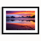 Colorful abstract art print of a Montana landscape in vibrant hues, framed with a black mat.
