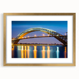 Extra large wall art featuring an abstract print of textured colors in muted earth tones, framed in gold.