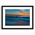 Colorful abstract art print of Cape Hatteras with textured design in vibrant hues on a large framed canvas.