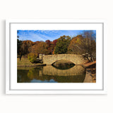 Abstract art print of Charlotte skyline in muted blue and gray tones on a framed white mat, suitable for dining room decor.