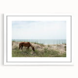 Abstract art print of the Outer Banks with soft blue and gray tones on a white framed canvas.