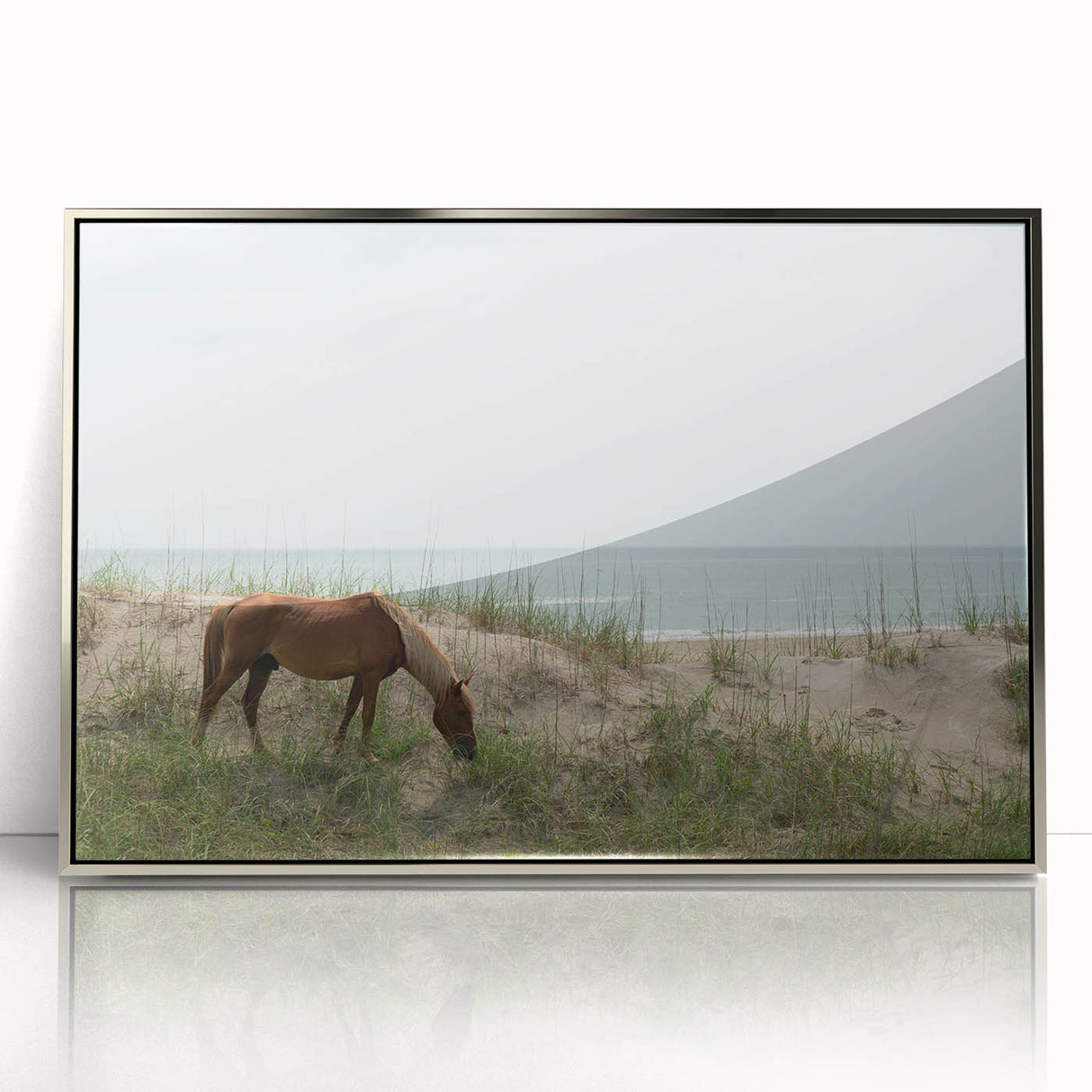 Mid-century modernist art depicting the Outer Banks in muted blue tones on a framed acrylic print.