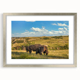 Textured art print of abstract North Dakota scenery in muted earth tones on a silver-framed mat.