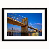 Colorful abstract art print of the Brooklyn Bridge in vibrant hues on a large framed canvas, ideal for living room decor.
