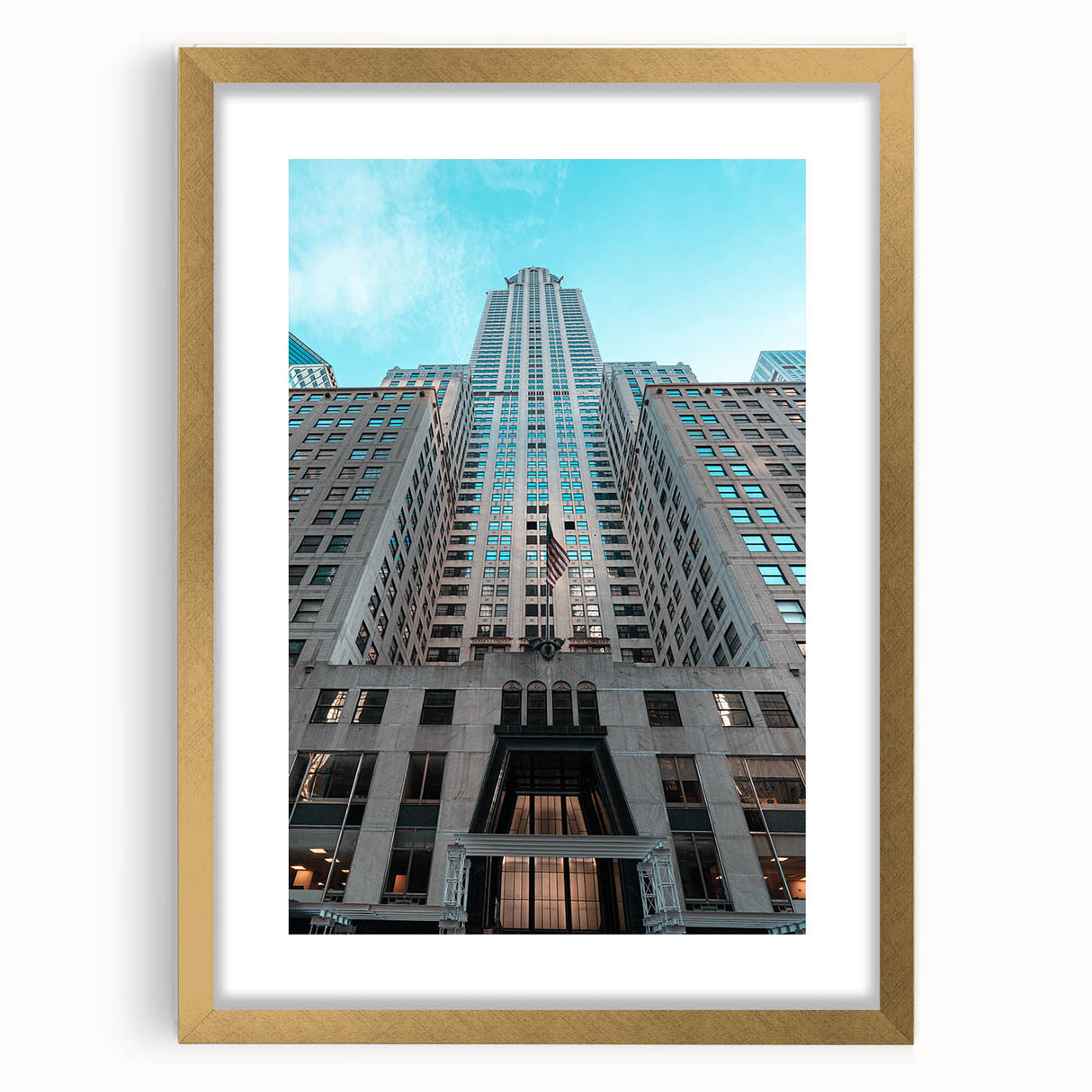 Extra large abstract art print of the Chrysler Building in textured gold and black tones, framed with a mat.