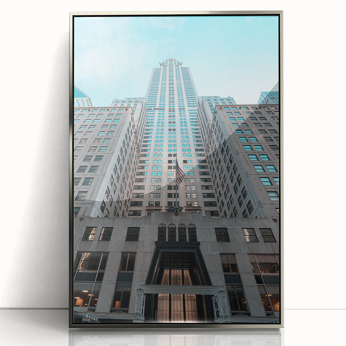 Mid-century modernist art of the Chrysler Building in silver and gray tones on a framed acrylic.