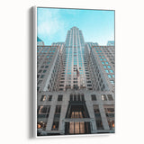 Vintage poster art of the Chrysler Building on a framed canvas, featuring black and colorful art.
