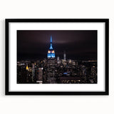 Extra large abstract art print of colorful New York City skyline, textured appearance, framed in black.