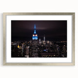 Textured art of abstract NYC skyline in muted gray tones on a framed silver mat, ideal for bedroom art.