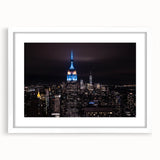 Abstract art print of NYC Empire State Building in muted gray tones on a framed white mat.