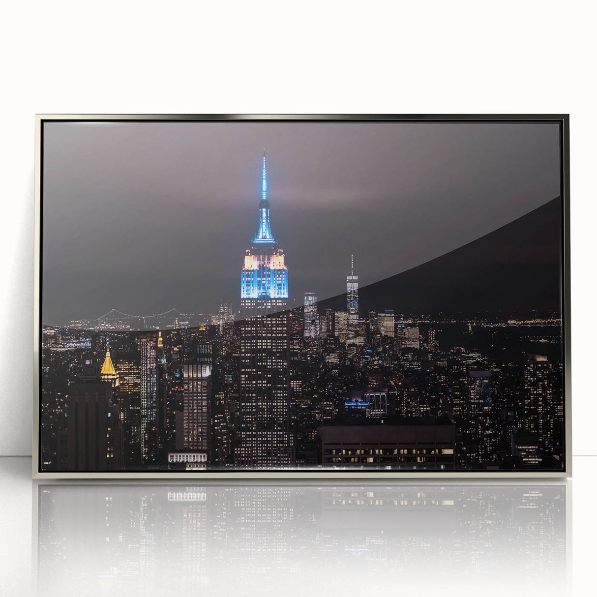 Mid-century modernist art depicting the Empire State Building in silver and gray tones on a framed acrylic print.