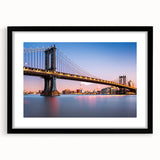 Extra large textured abstract art print of Manhattan Bridge in colorful hues, framed in black, ideal for living room decor.