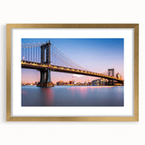 Extra large wall art featuring an abstract print of the Manhattan Bridge in textured gray and blue tones, framed in gold.