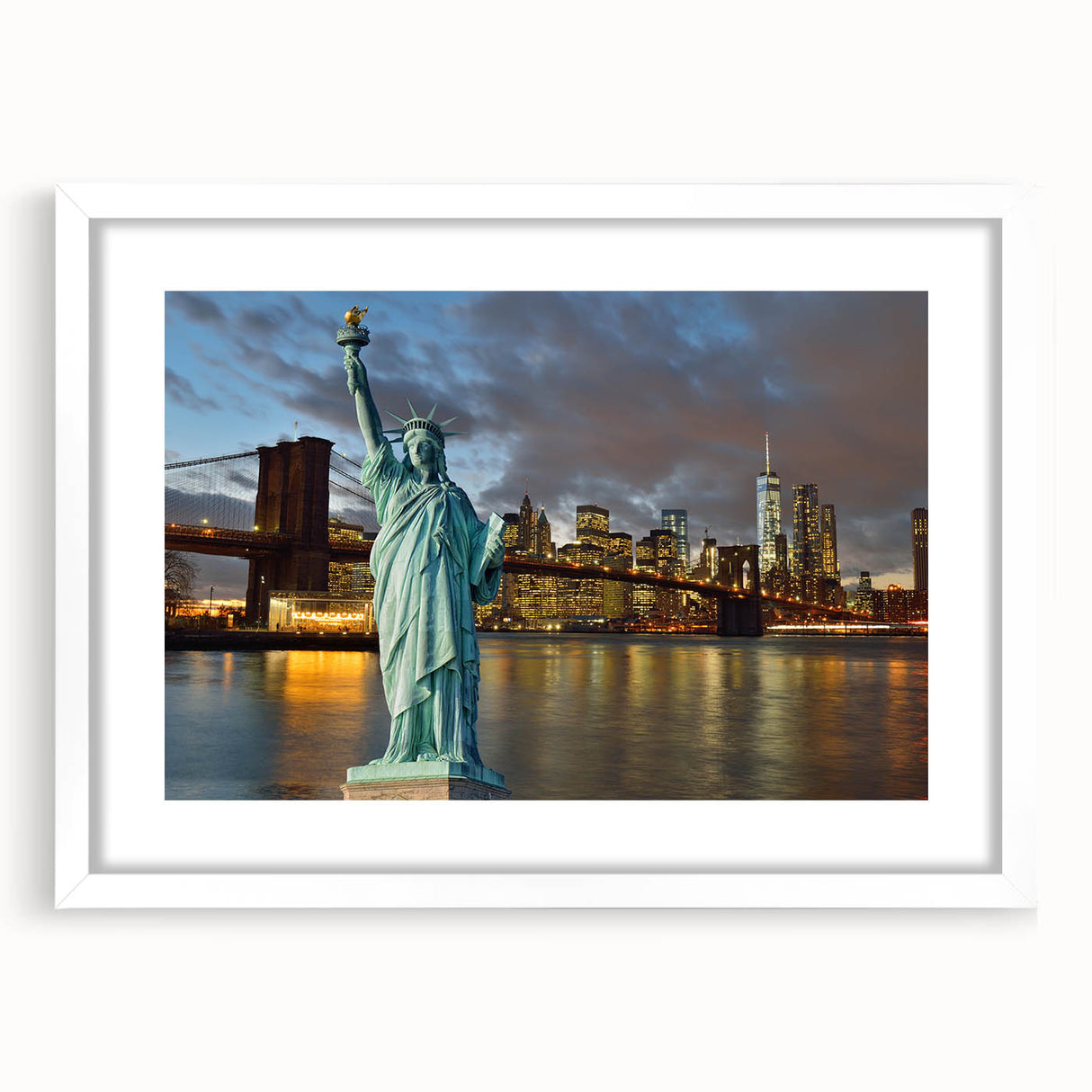 Abstract art print of the Statue of Liberty in muted blue and green tones on a white framed canvas.