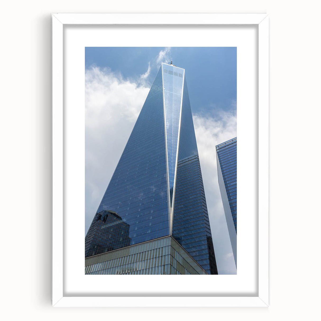 Abstract art print of NYC skyline in muted gray tones on a white-framed canvas, suitable for bedroom or dining room decor.