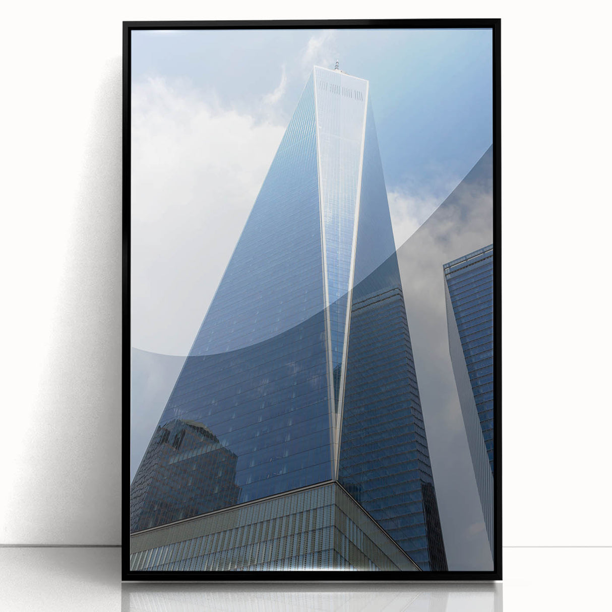 Large abstract wall art of NYC skyline in black and gray tones on framed acrylic, ideal for modern living room decor.